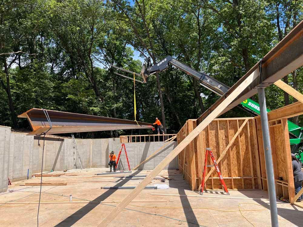 A group of construction workers are working on a building under construction.