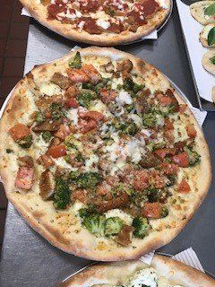 meat and green pizza