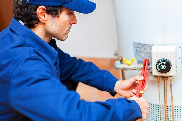 Man working on a water heater