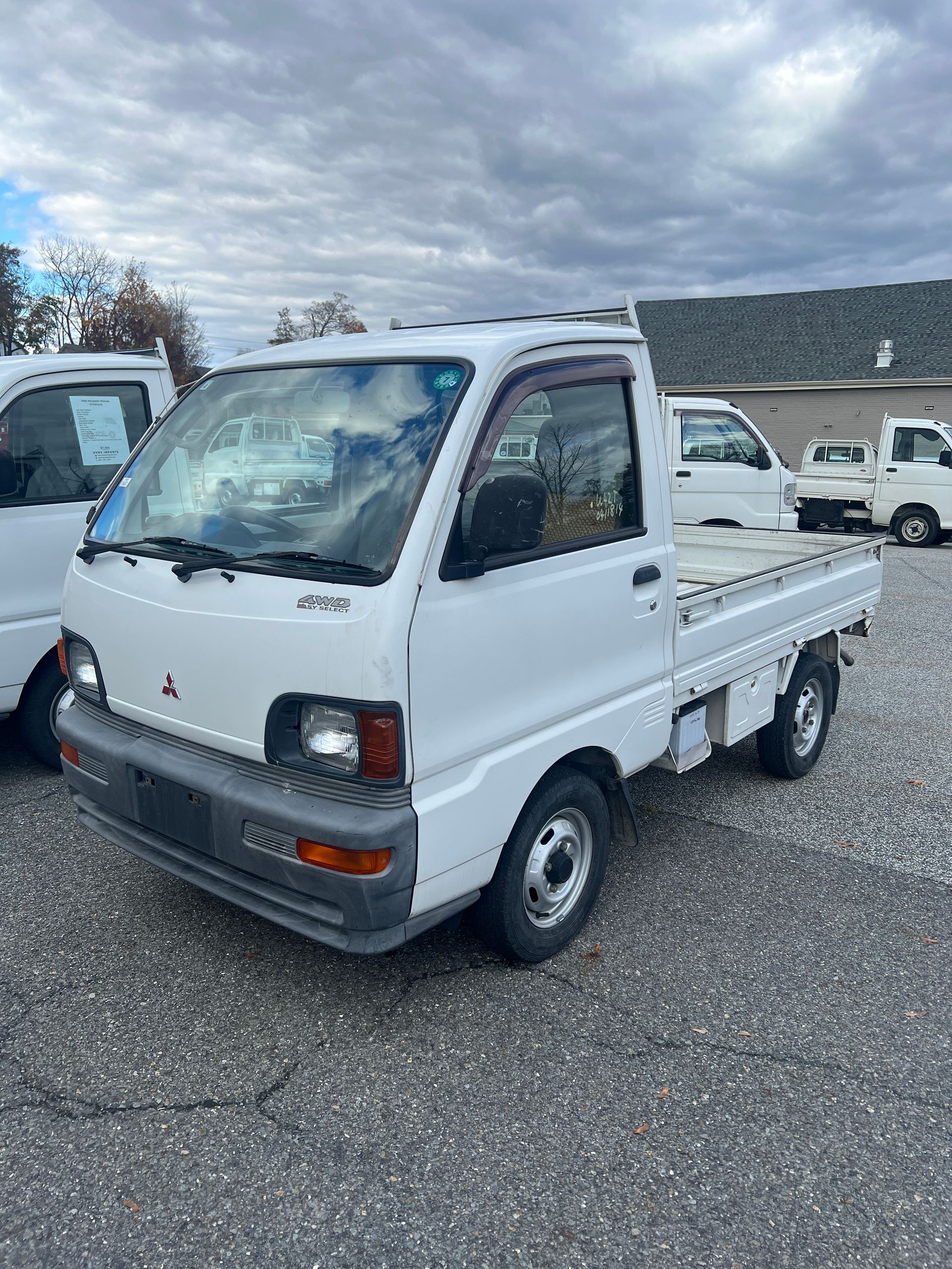 A kei truck for sale 1996 Mitsubishi Minicab for sale in a parking lot