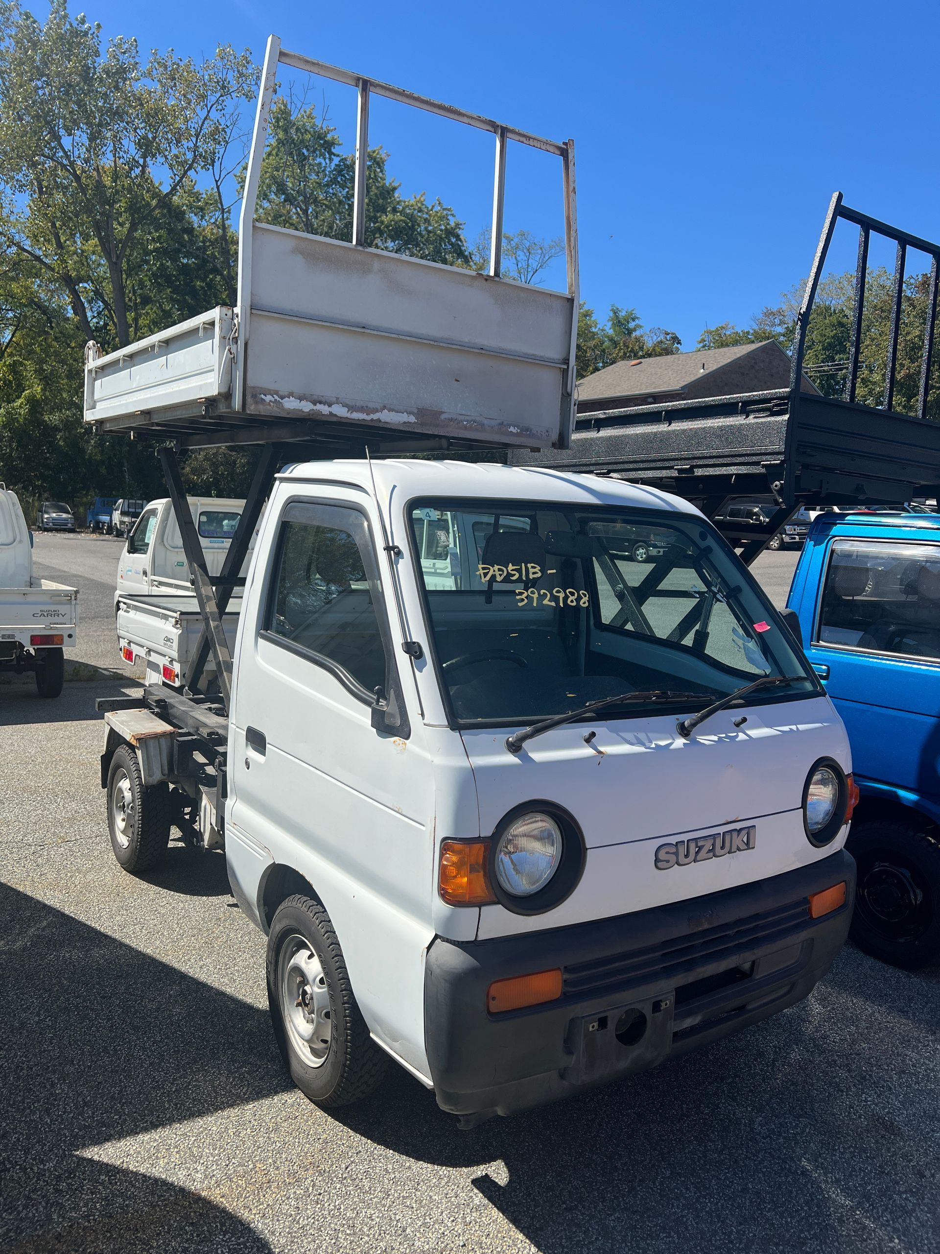 A kei truck for sale 1996 Suzuki Carry Scissor Dump Truck for sale in a parking lot