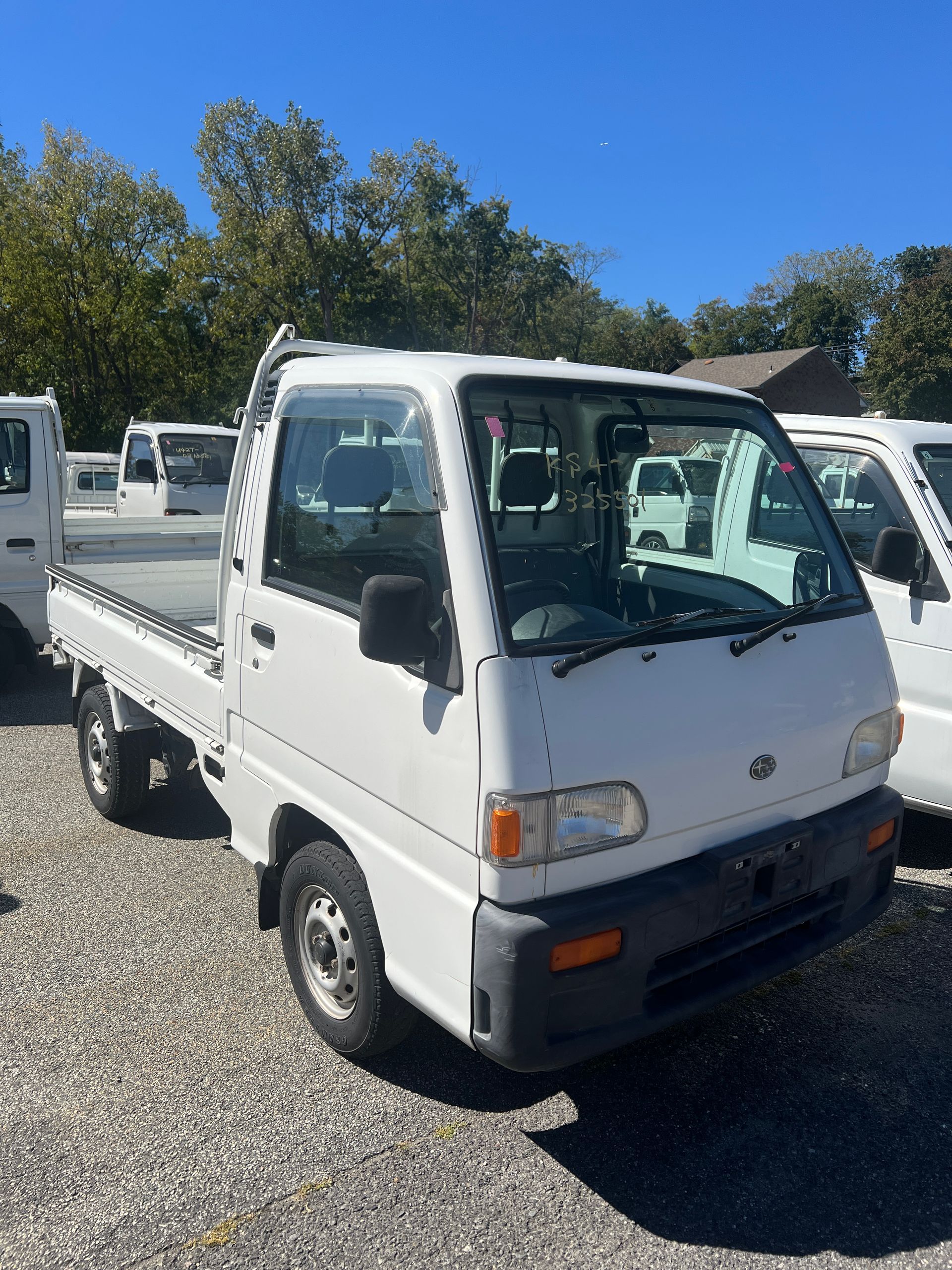 A kei truck for sale subaru sambar for sale in a parking lot