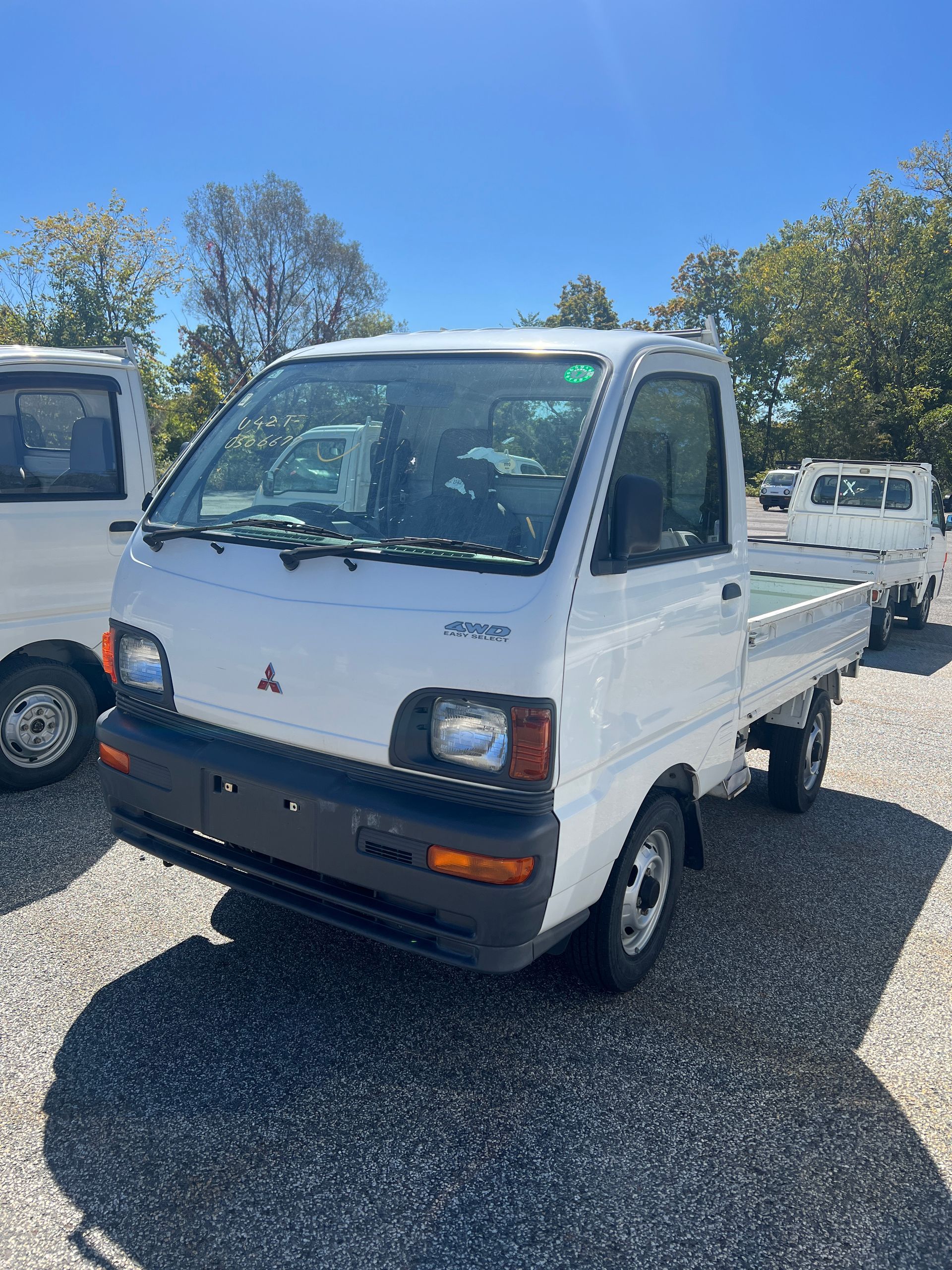 A kei truck for sale Mitsubishi Minicab for sale in a parking lot