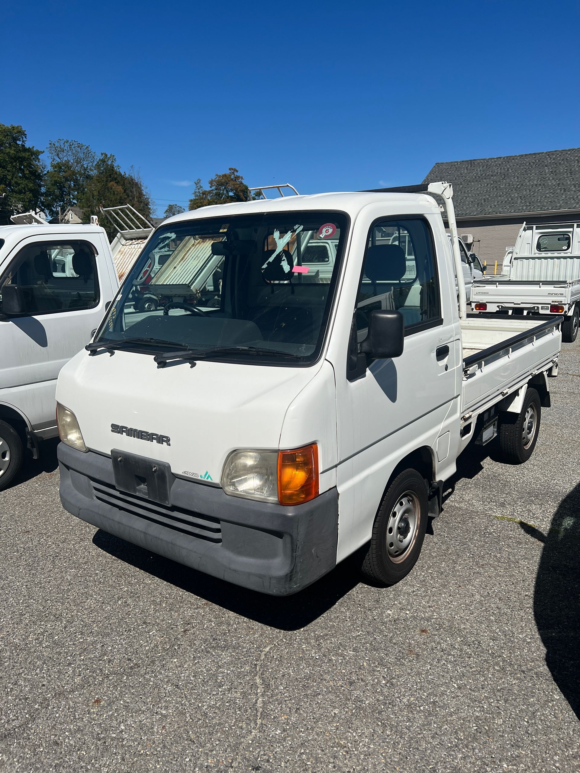 A kei truck for sale 1999 Subaru Sambar Kei truck for sale in a parking lot