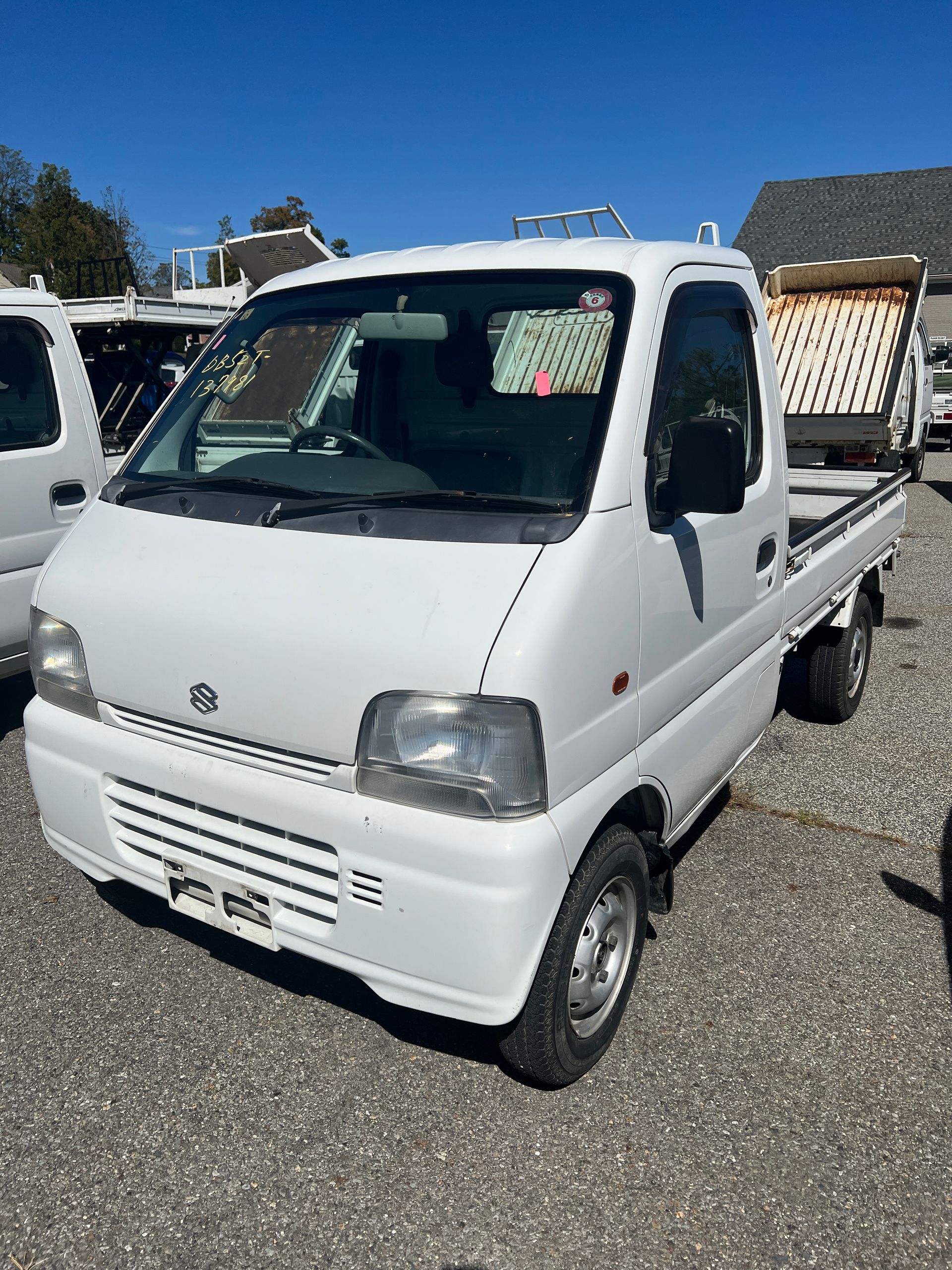 A kei truck for sale 1999 Suzuki Carry Kei truck for sale in a parking lot
