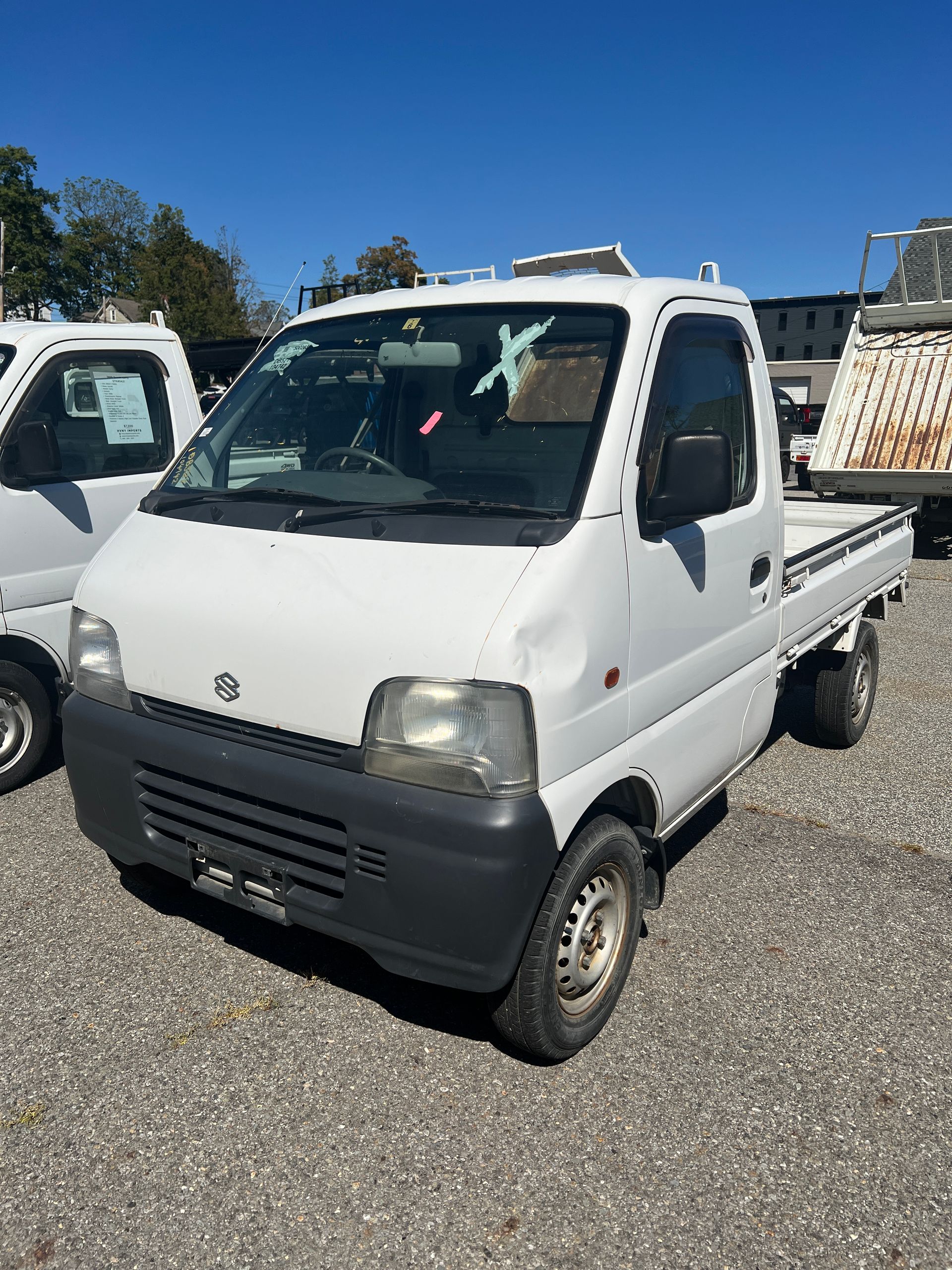 A kei truck for sale 1999 Suzuki Carry Kei truck for sale in a parking lot