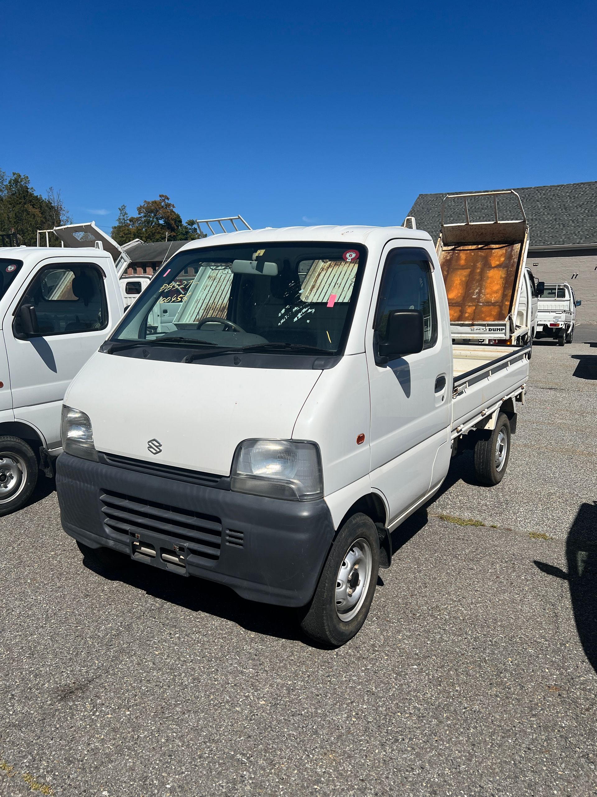 A kei truck for sale 1999 Suzuki Carry Kei truck for sale in a parking lot