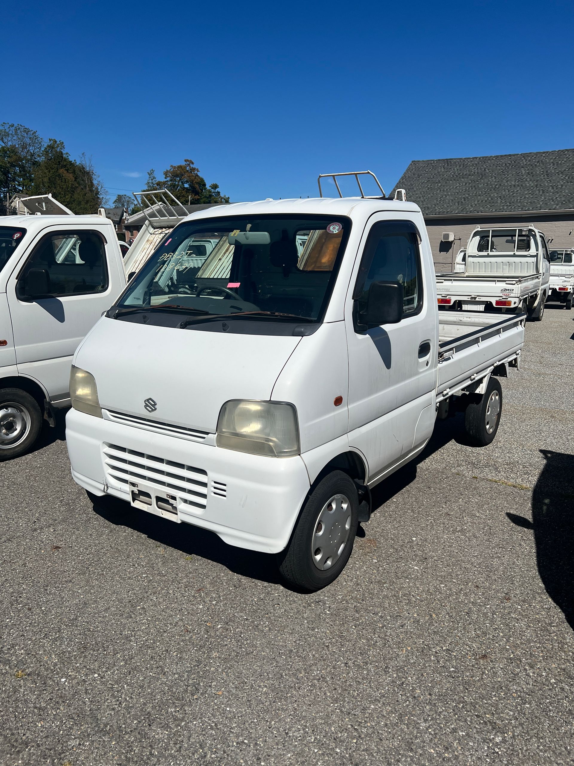 A kei truck for sale 1999 Suzuki Carry Kei truck for sale in a parking lot