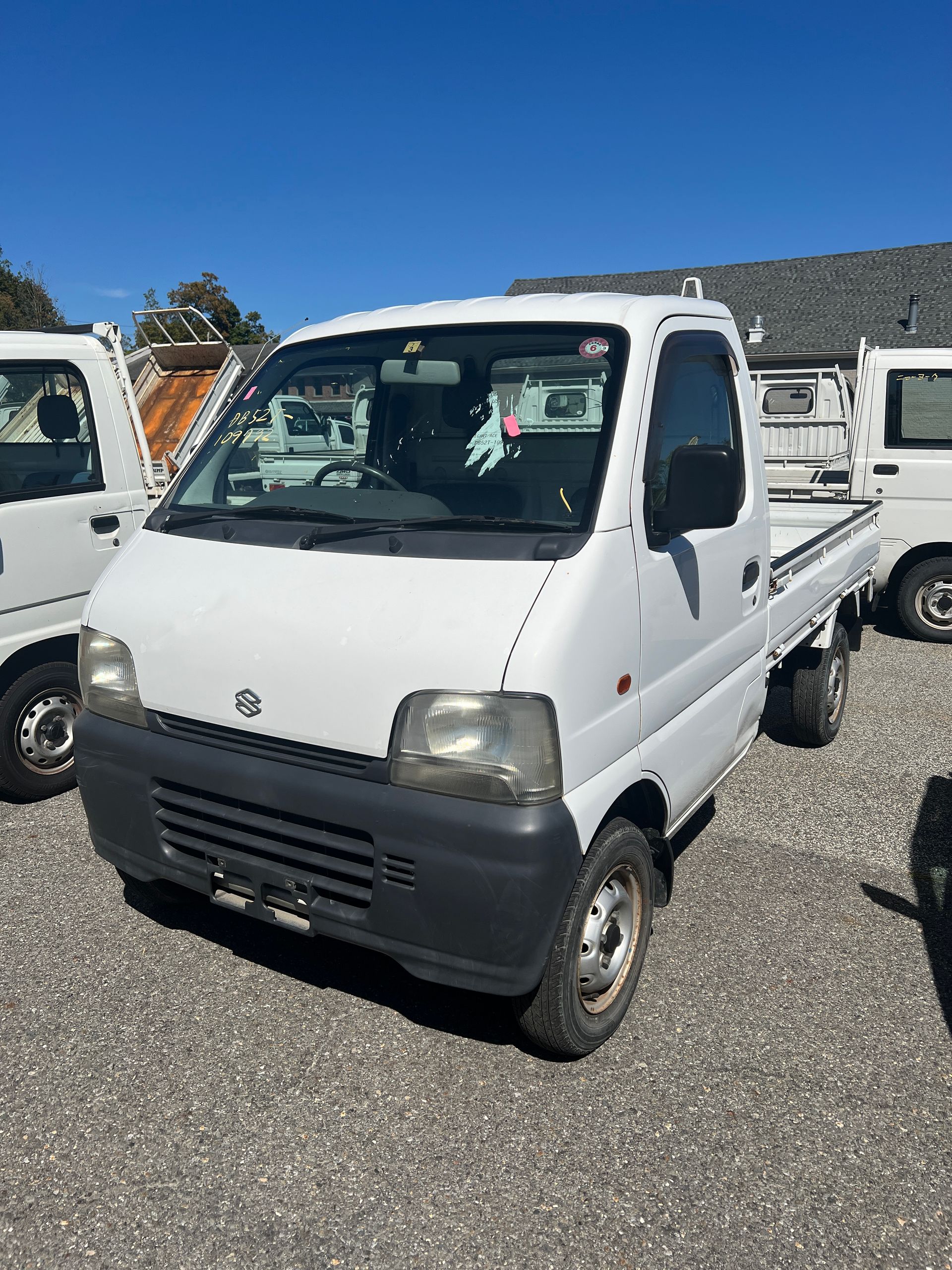 A kei truck for sale 1999 Suzuki Carry Kei truck for sale in a parking lot