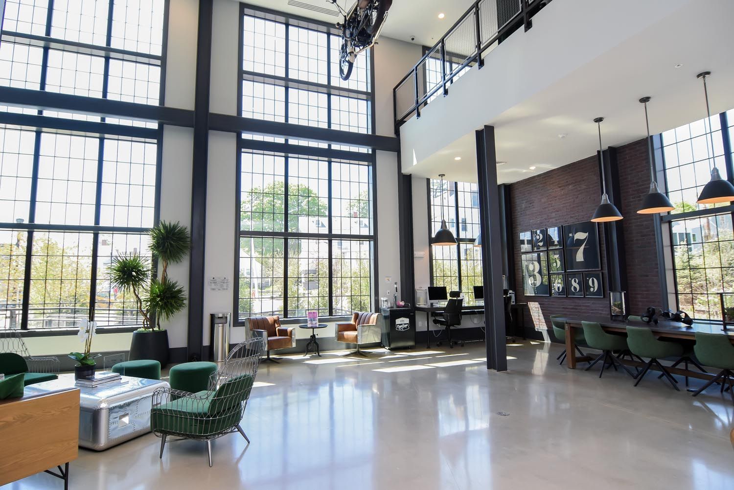 A large room with a lot of windows and furniture.