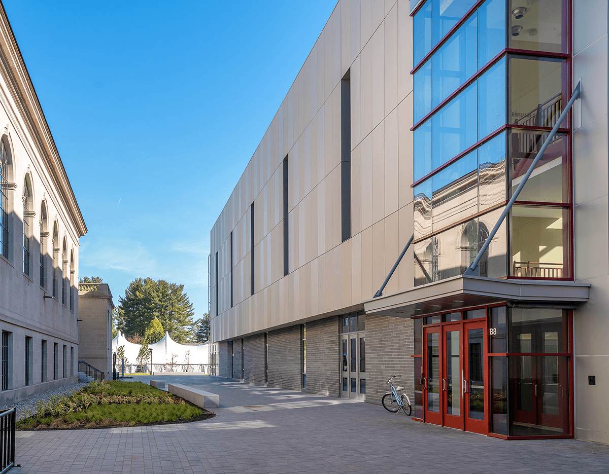 A large building with a bicycle parked in front of it.
