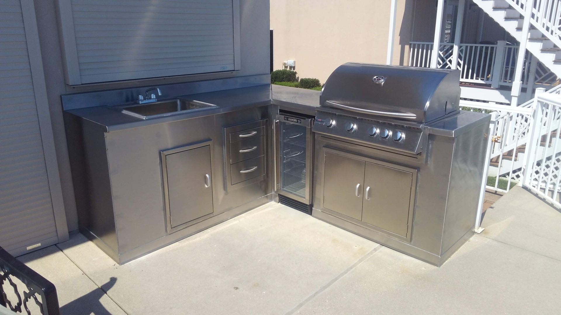 Sandy surface with wavy patterns of light and shadow.