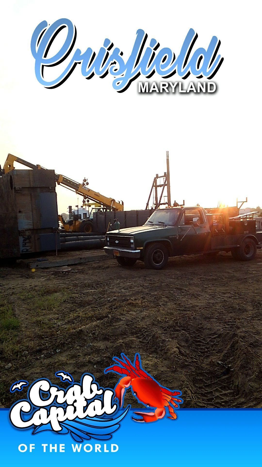 Crisfield, Maryland, with crab graphic overlay. A truck in front of a construction scene at sunset.