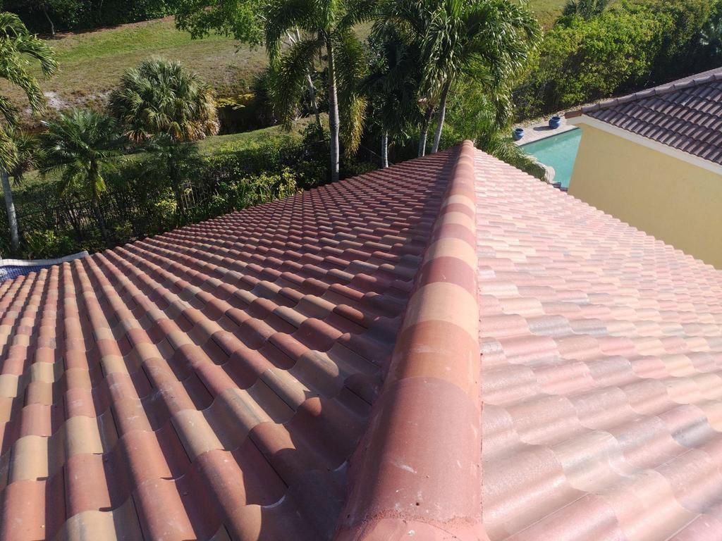 An aerial view of a roof being installed on a house.