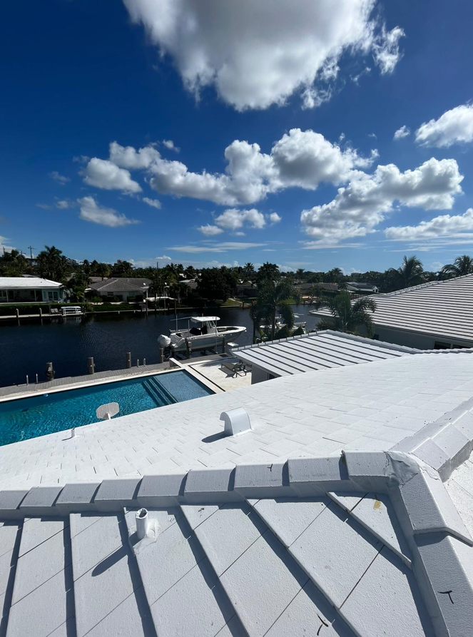 A view of a swimming pool from the roof of a house