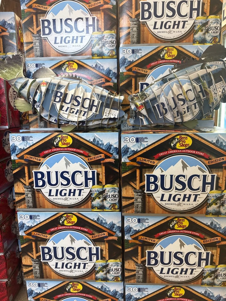 Four boxes of busch light beer are stacked on top of each other