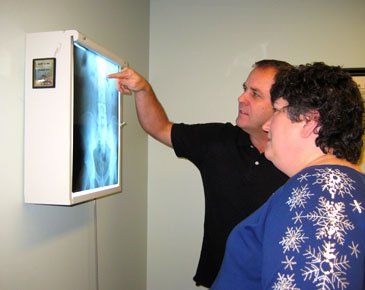 Showing the x-ray to patient