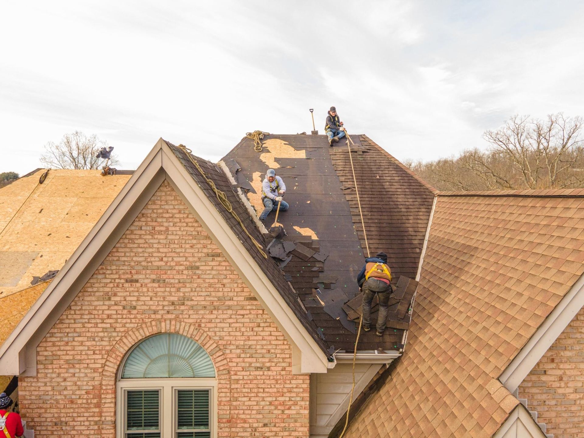Contractors on the roof installing