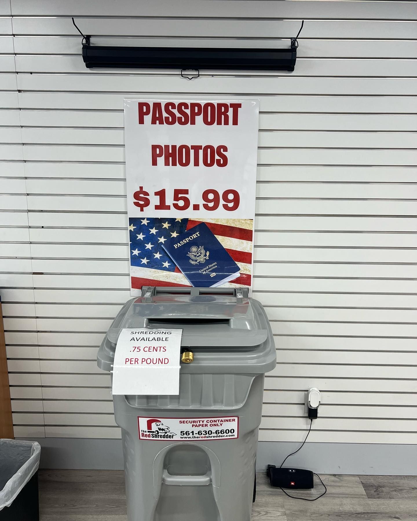 A gray plastic bin labeled 