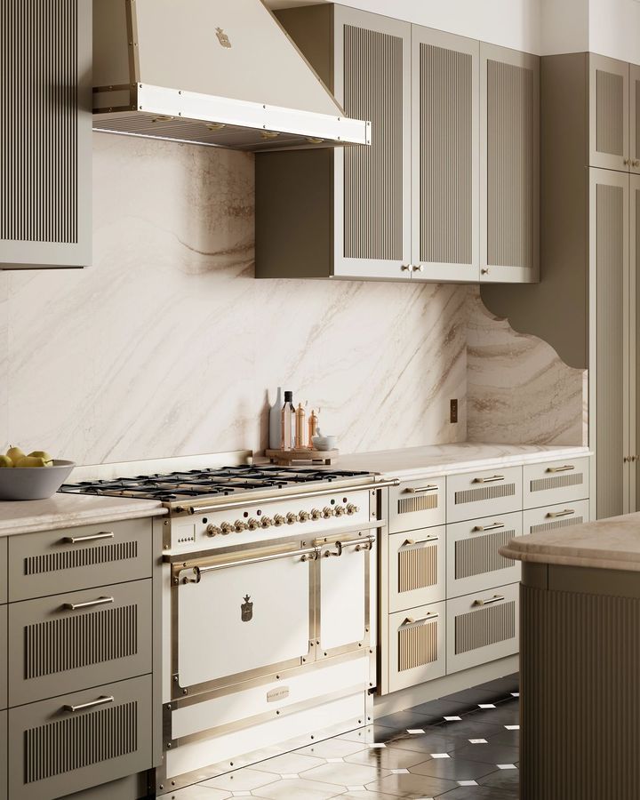 Elegant kitchen with olive cabinets, marble backsplash, and large oven with range hood.