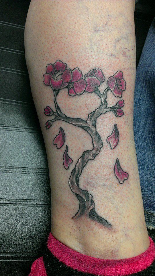 Tree with flower tattoo