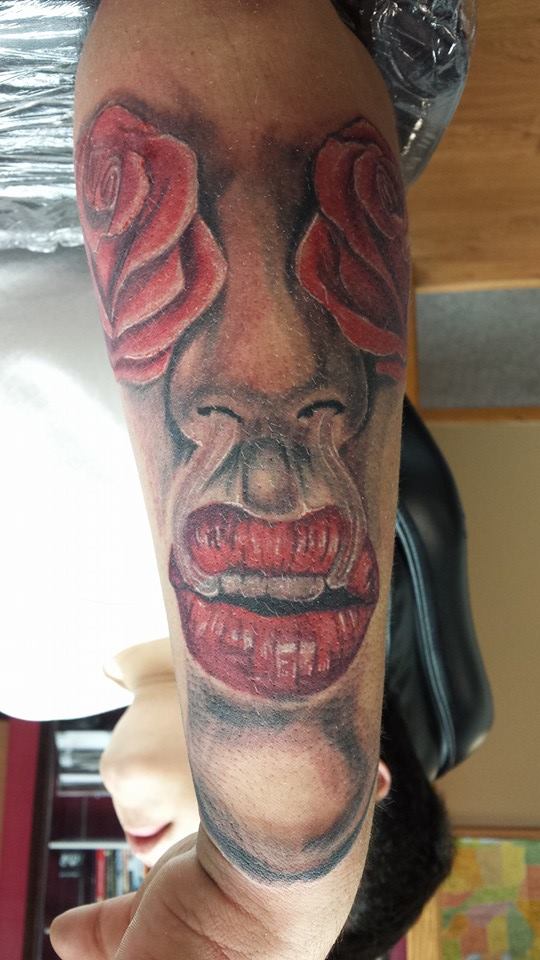 Roses and lip tattoo