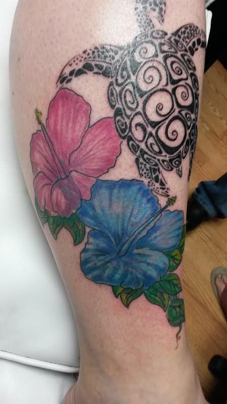 Turtle with flowers tattoo