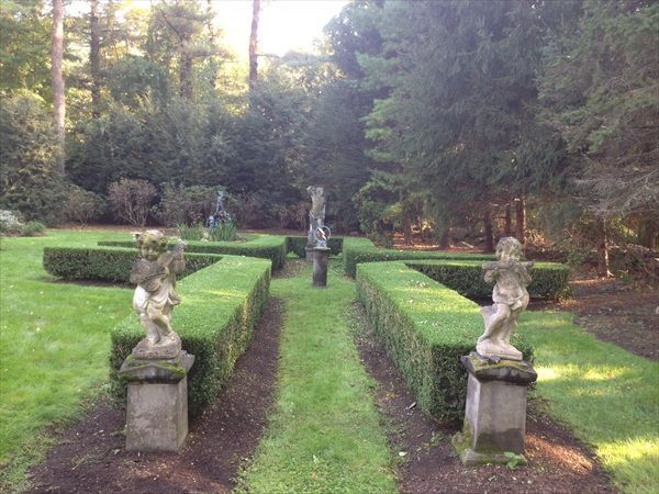 A garden with statues in the middle of it