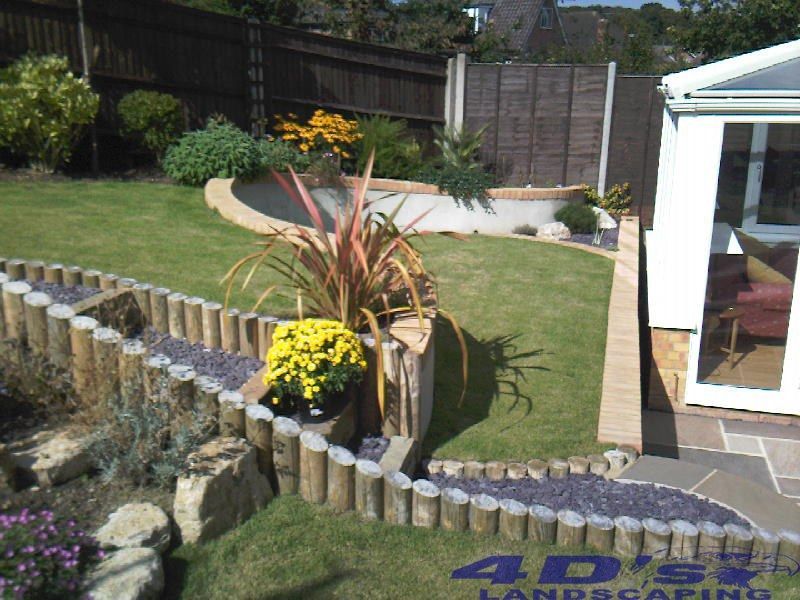 A garden with a sign that says 4dsx landscaping