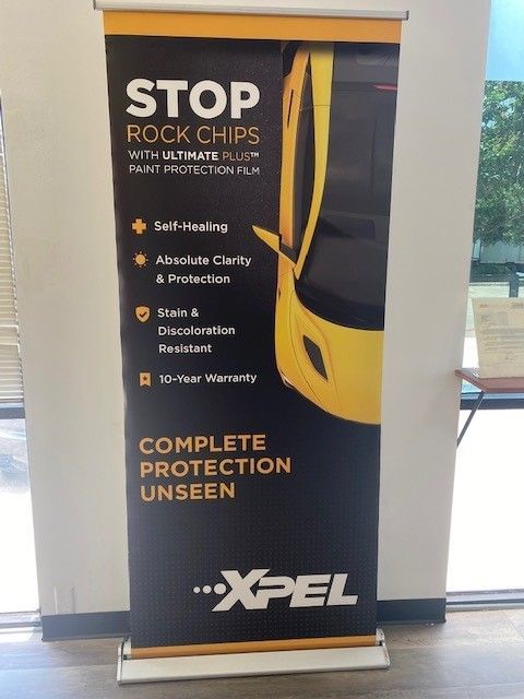 A sign that says stop rock chips complete protection unseen