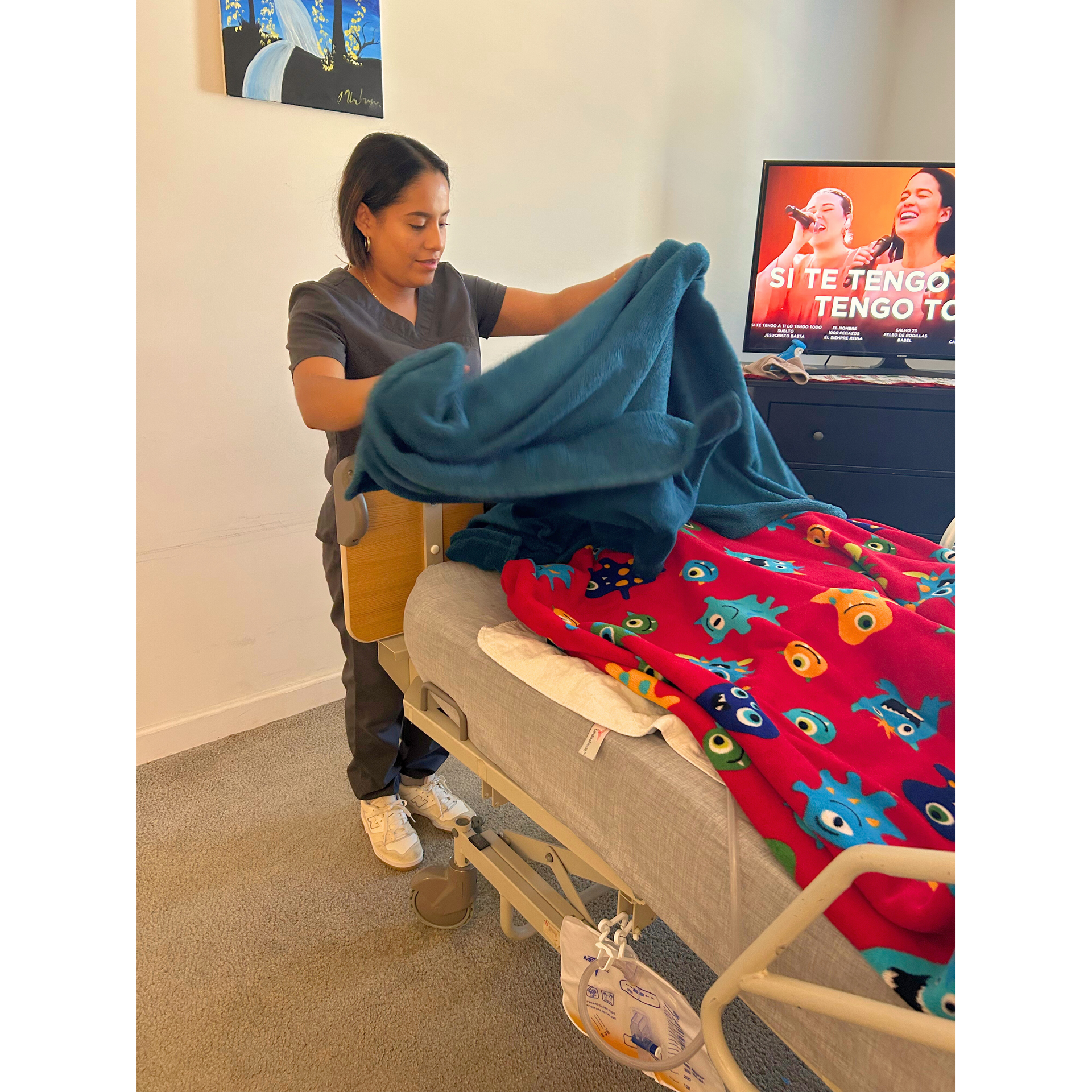 Our caregiver Carmen folding laundry for our senior client.