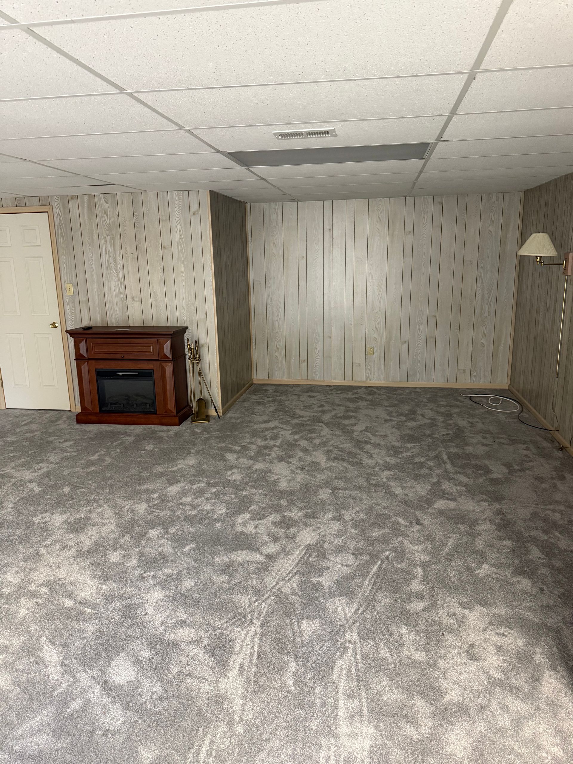 There is a fireplace in the middle of the room.