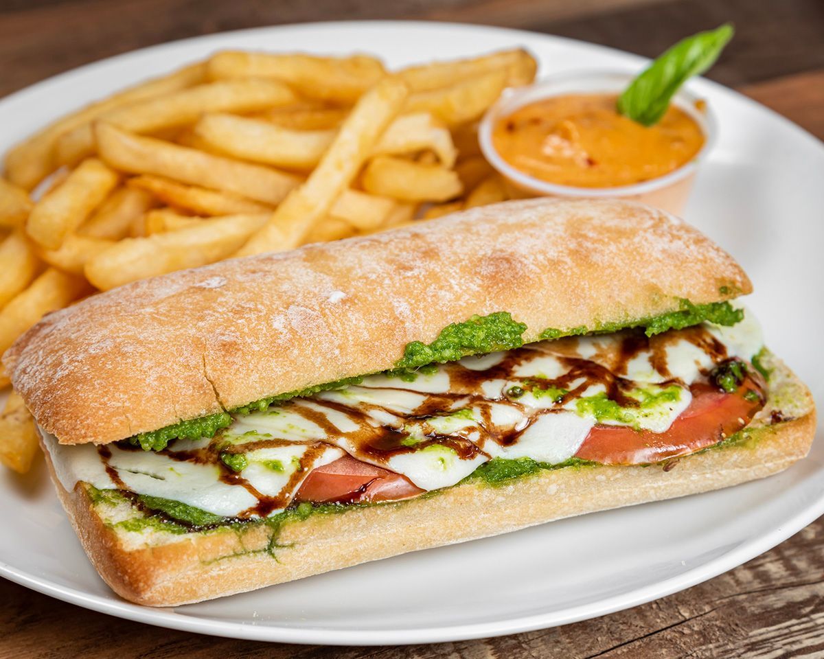 A sandwich and french fries on a white plate