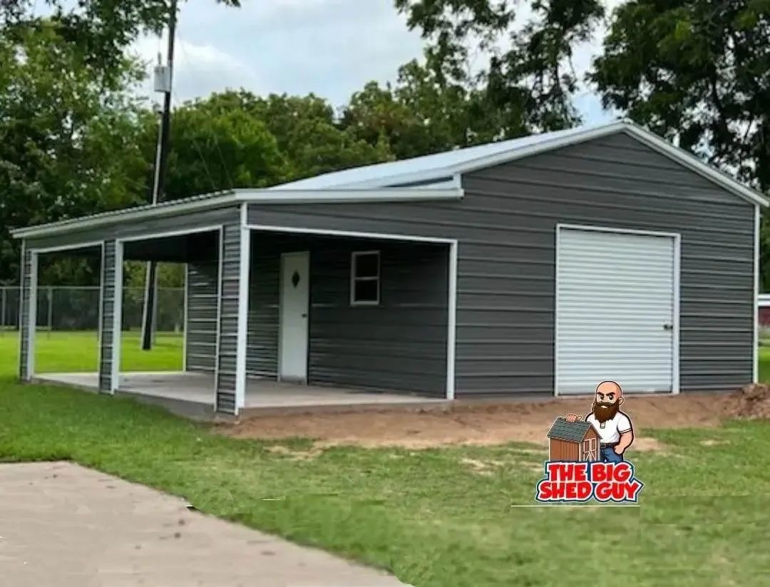 Gray metal building with carport, white door, and garage door on a grassy lot.