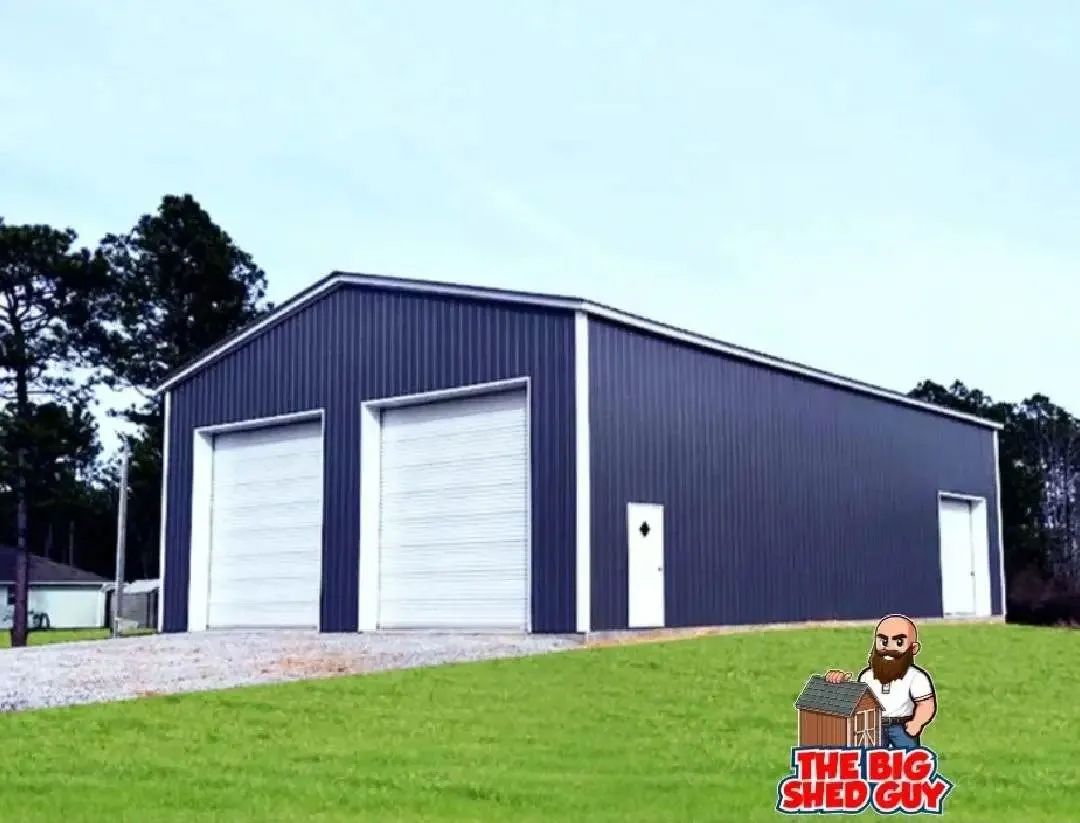 Blue metal shed with two garage doors and a man with a beard logo in a grassy field.