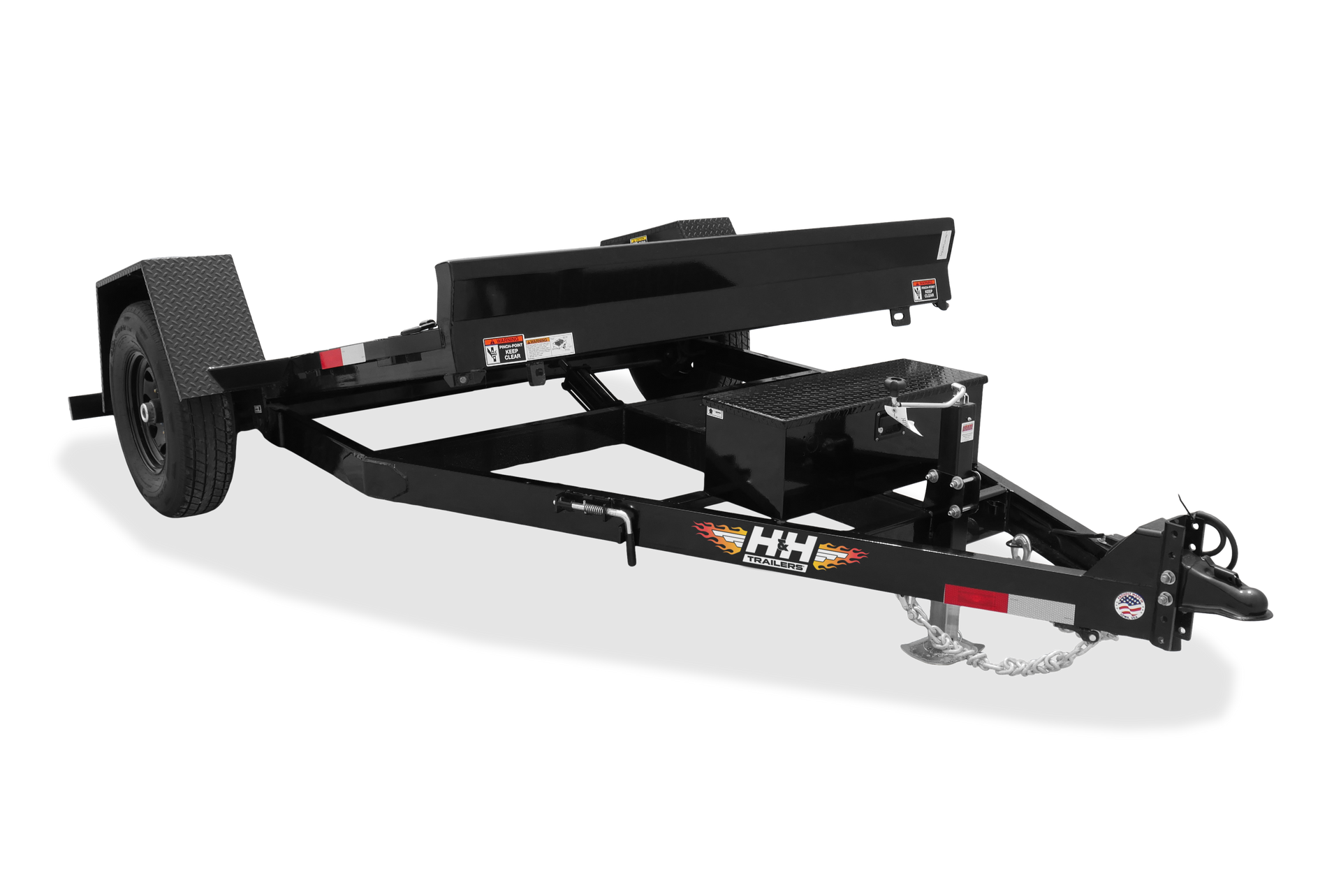 A flatbed trailer with a wooden deck is parked next to a white trailer.