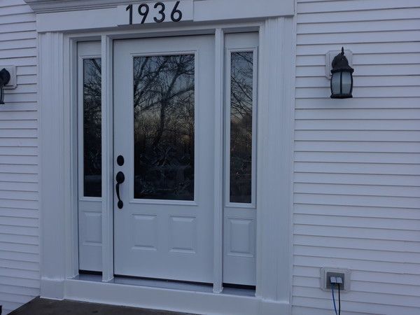 A white door with the number 1936 on it