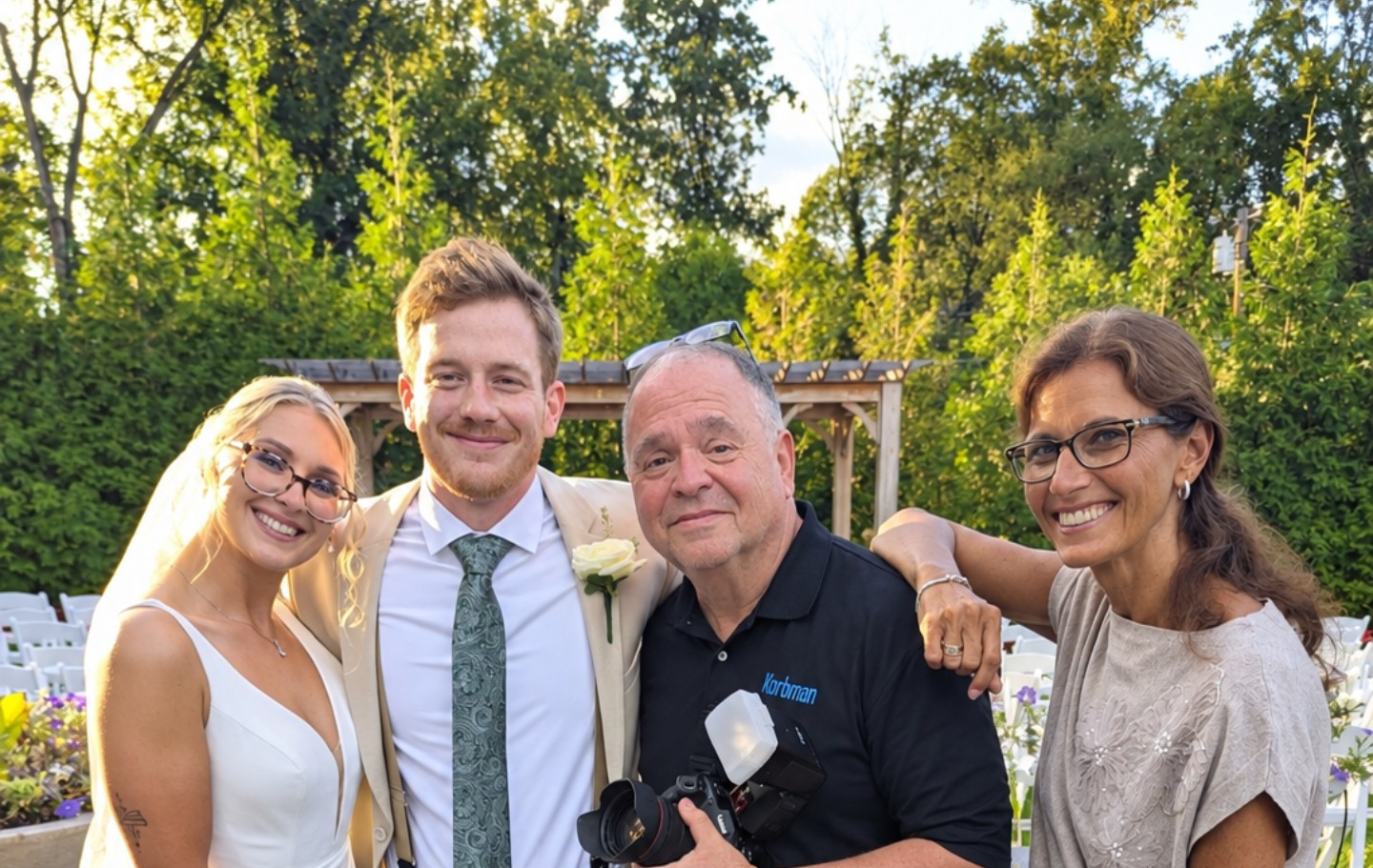 Wedding photographer Barry Korbman embraced by Samantha and Sean at their NJ Wedding