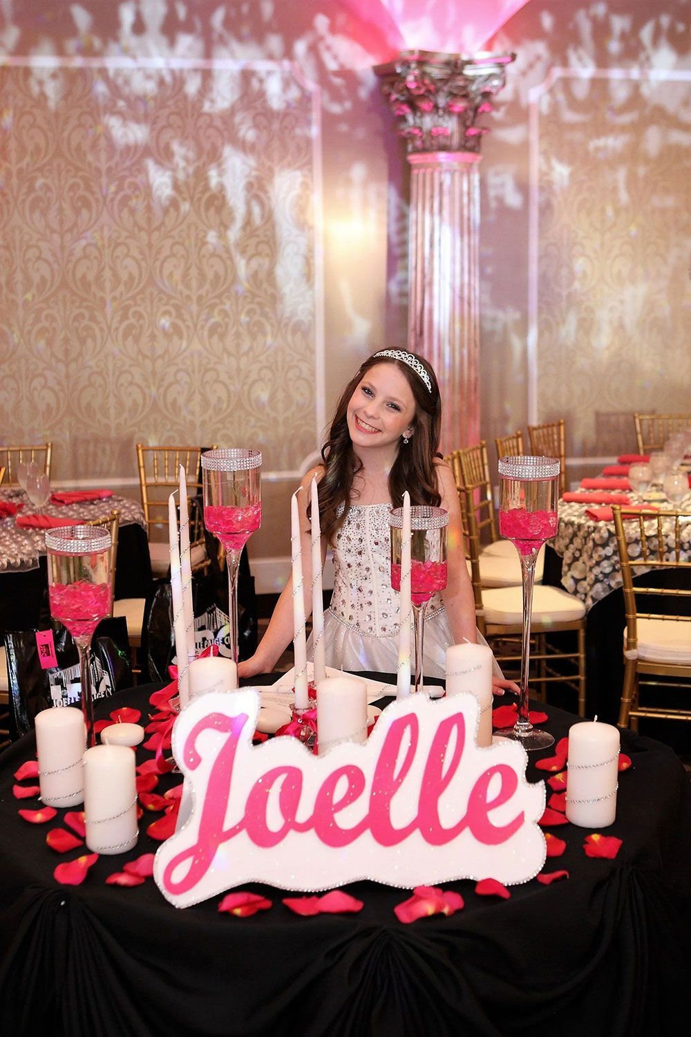 Girl at decorated table with her name 