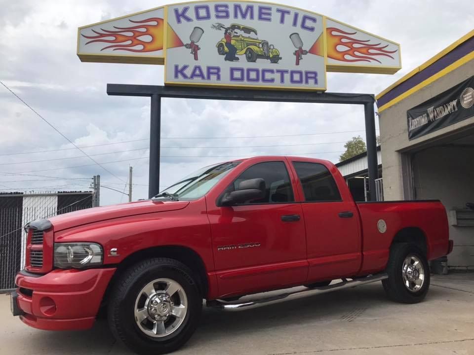 Red Dodge Ram truck parked in front of a
