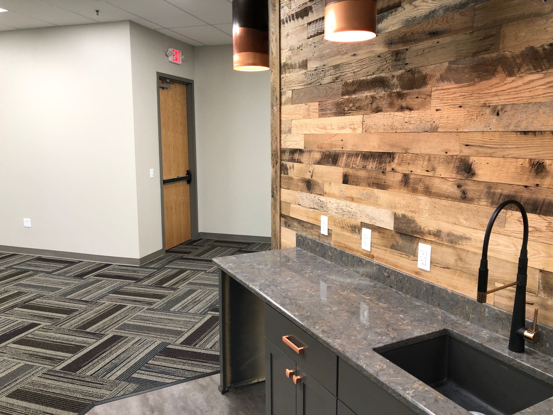 A large house with a large deck and stairs.