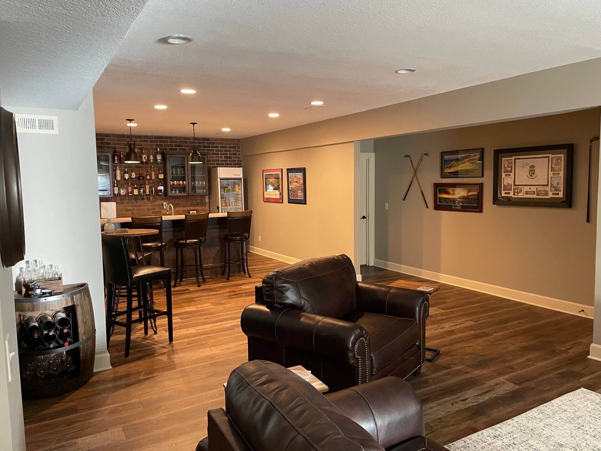 A living room filled with furniture and a bar.