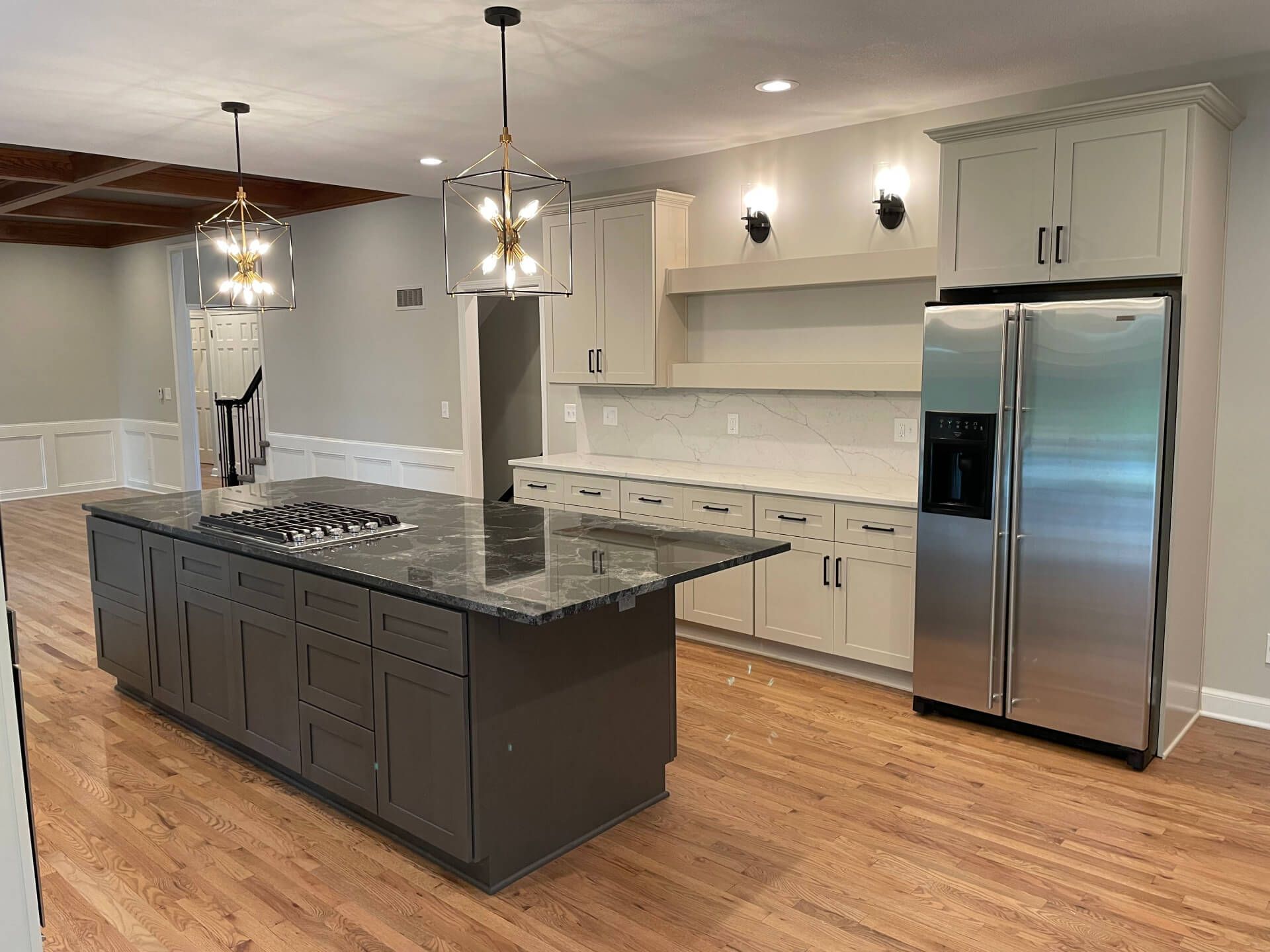 There is a large island in the middle of the kitchen.