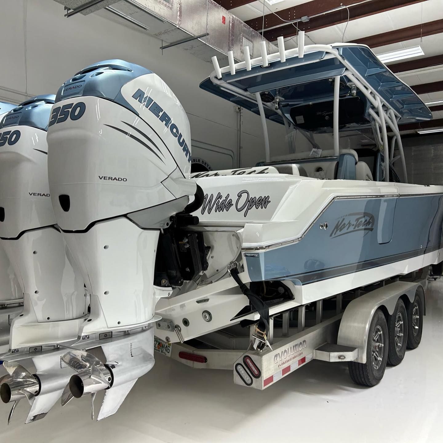 A white and blue powerboat, 