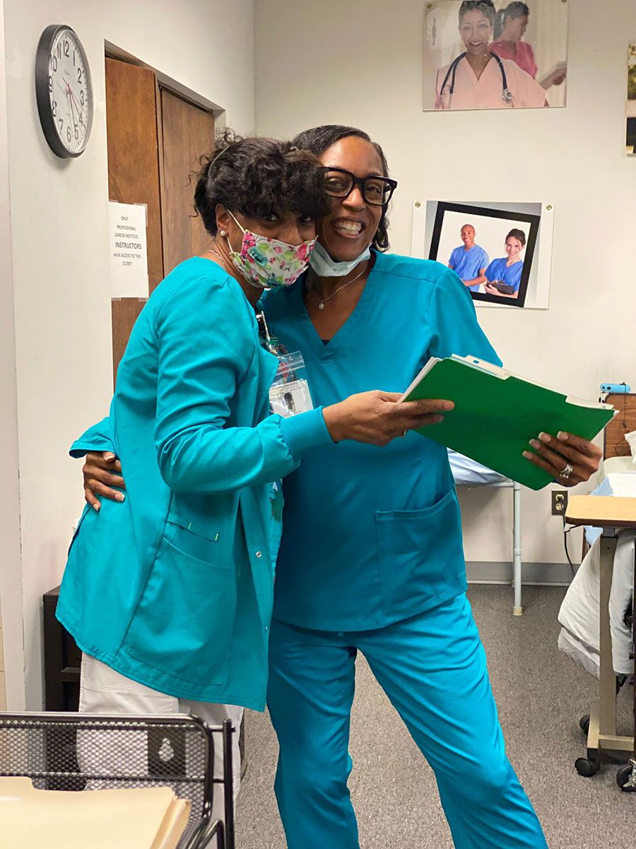 Medical staff hugging each other