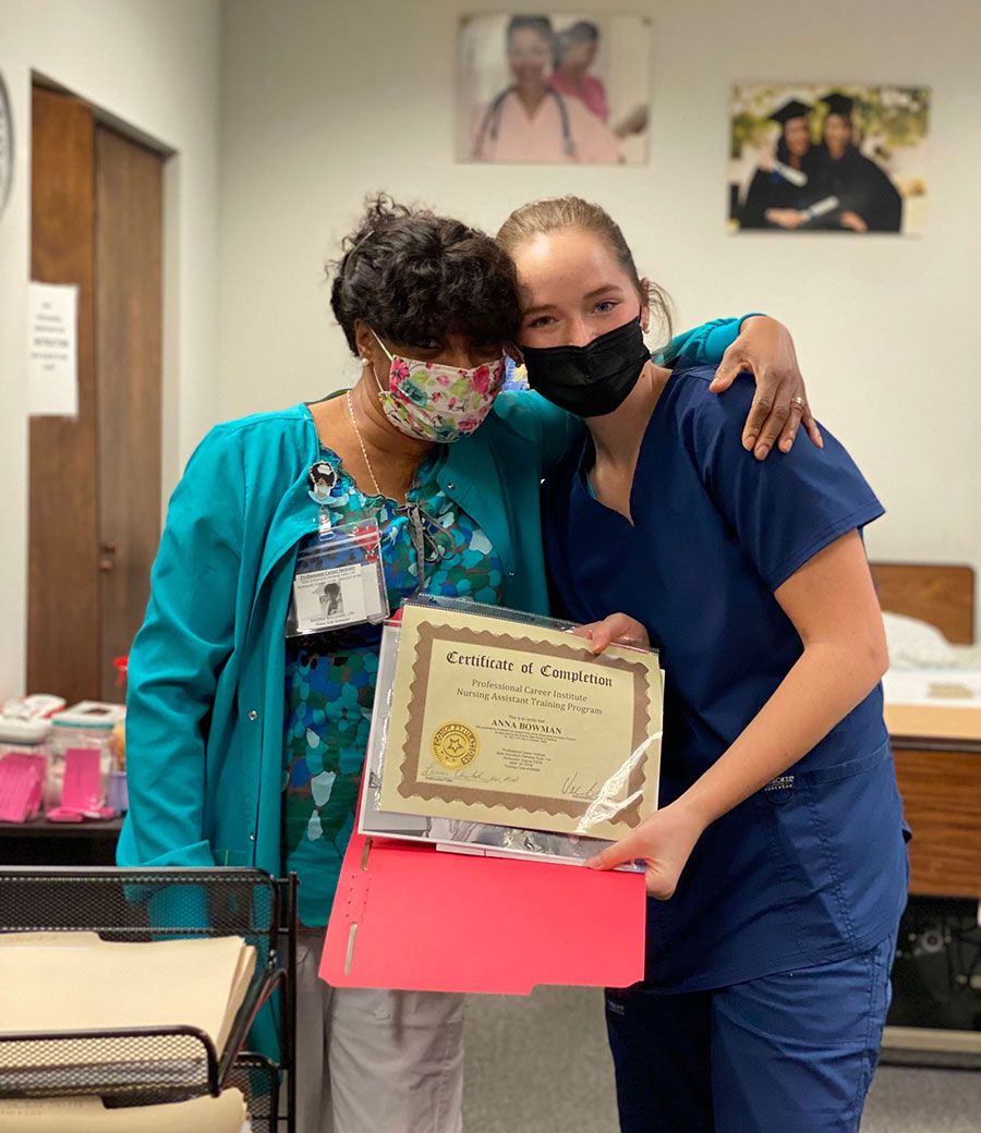 Health Professional Trainee holding a certificate