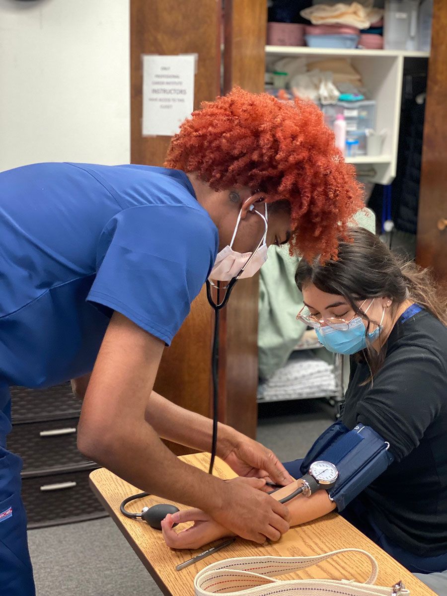 Health Professional Trainee taking blood pressure