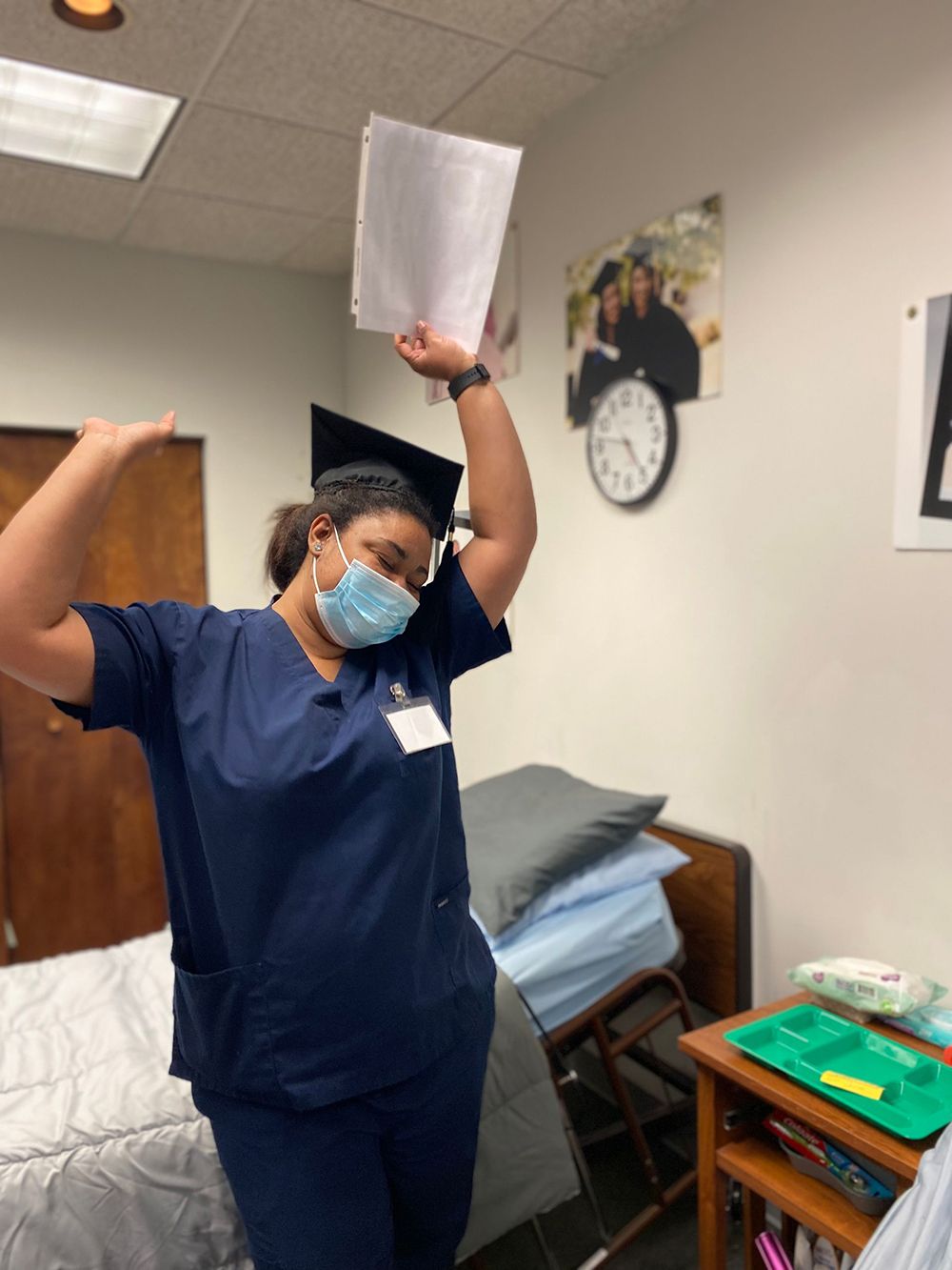 Woman celebrating her graduation from the Nursing Assistant Training Program