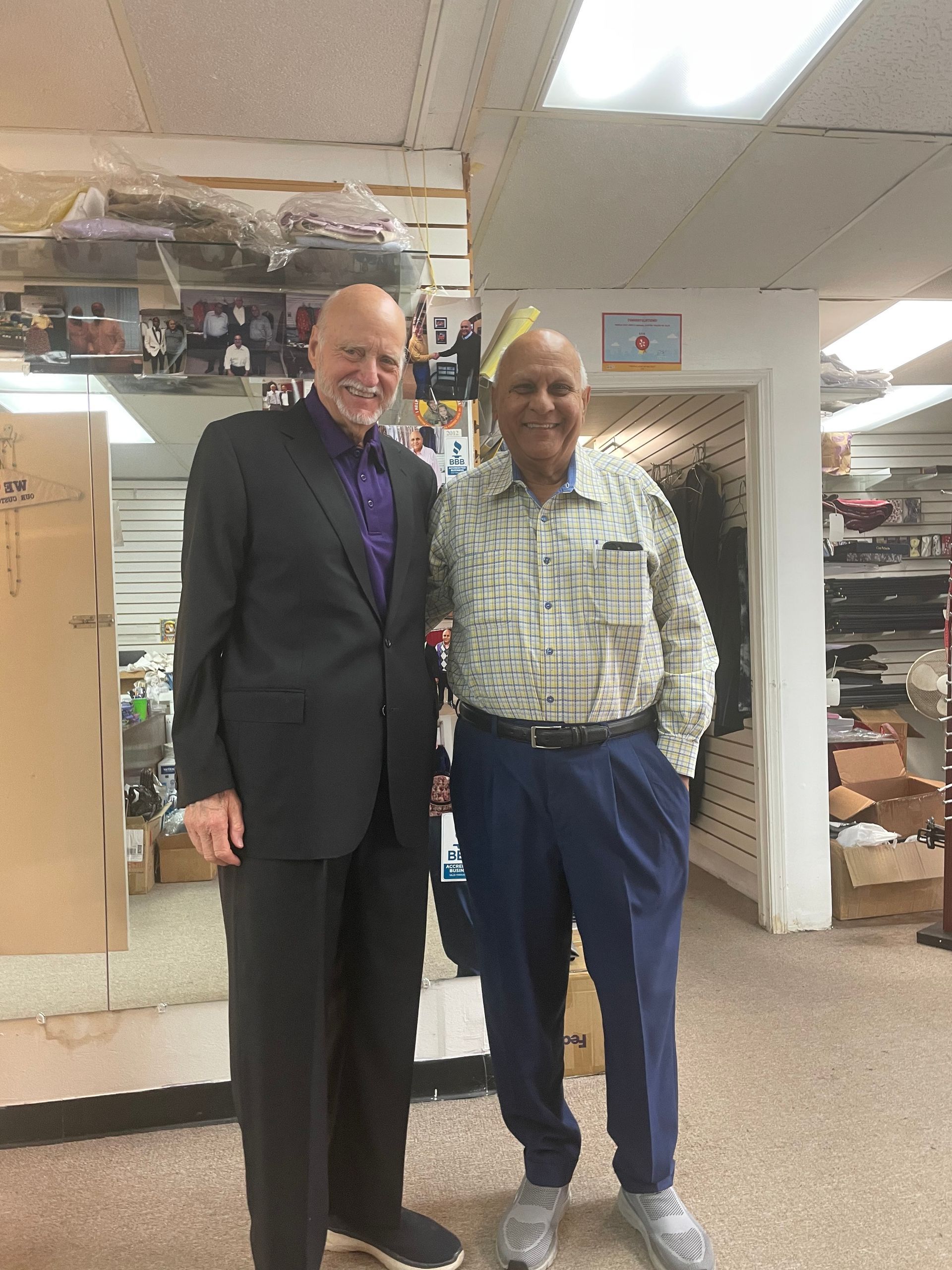 Two men standing next to each other in a store