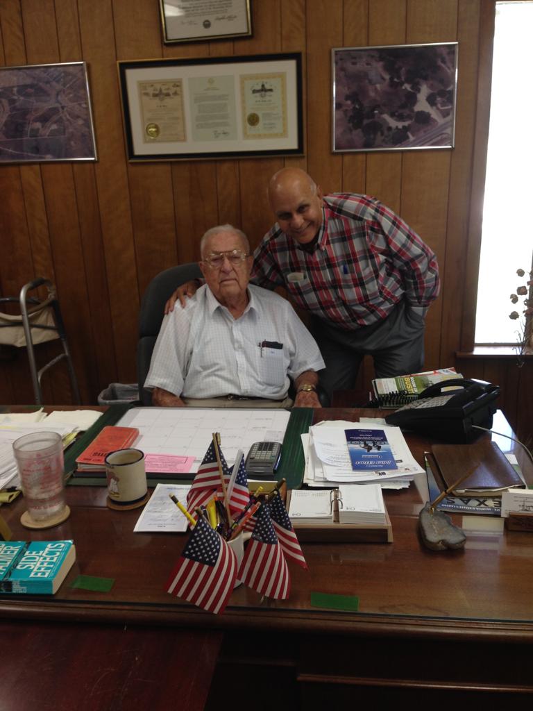 Two men posing for picture